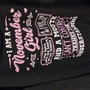 BLACK hooded sweatshirt with November saying on the back.